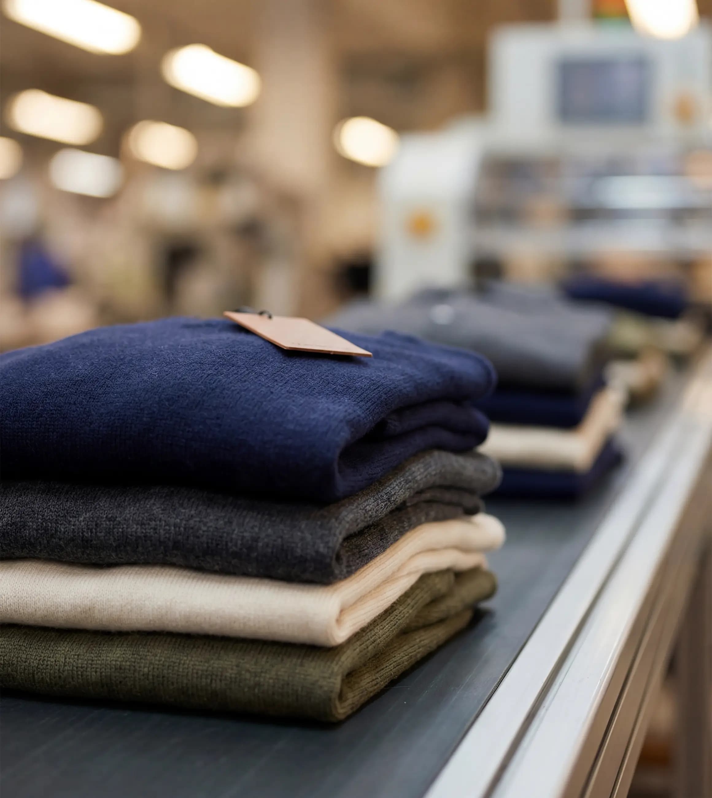 Stacks of ready-made garments waiting for a brand label